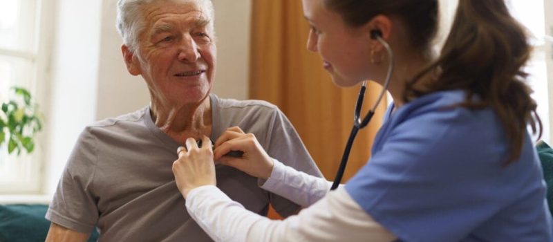Young,Nurse,Checking,Elderly,Senior,In,His,Home.