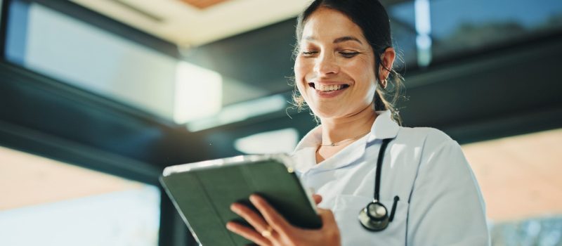 Medical,,Smile,Or,Woman,In,Hospital,With,Tablet,,Telehealth,Or
